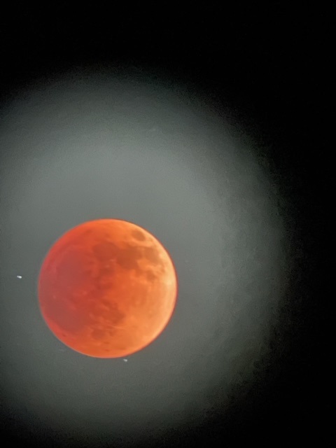 Lunar eclipse picture with a blood moon glowing in red